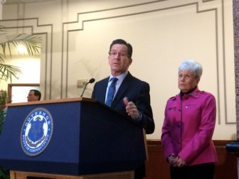 Gov. Dannel P. Malloy and Lt. Gov. Nancy Wyman as Malloy addresses reporters.