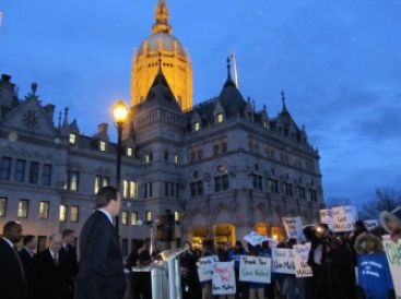 Malloy with charter school advocates in 2012