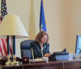 Esty at her desk vertical crop
