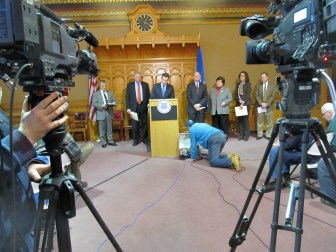 Gov. Dannel P. Malloy, Attorney General George Jepsen, Comproller Kevin Lembo and others at a televised news conference on the Anthem cyber attack.