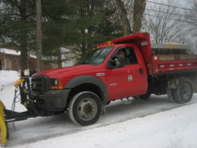 Plow at work clearing local roads and spreading salt.