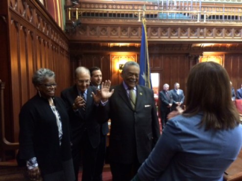 Ed Gomes takes the oath from Secretary of the State Denise Merrill after winning a special election. From left, his former intern, Sen. Marilyn Moore, with Sens. Martin Looney and Bob Duff.
