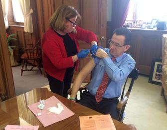 Gov. Dannel P. Malloy got a flu vaccination in his office Friday