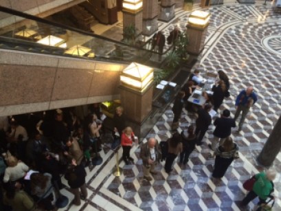 A line forms to testify at a public hearing on the governor's proposed budget.
