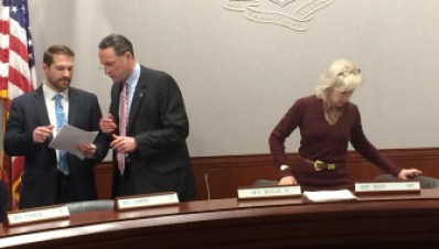 Sen. Paul Doyle, center, consults with staff at start of Energy and Technology Committee. At right is his co-chair, Rep. Lonnie Reed.