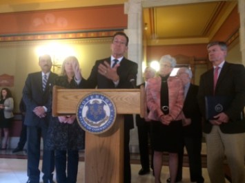 Gov. Dannel P. Malloy names Cameron Staples, at right, as chairman of his Transportation Finance  Panel.