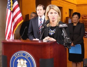 Federal Railway Administrator Sarah Feinberg speaks at New Haven's Union Station Friday, with U.S. Sen. Richard Blumenthal, left, and New Haven Mayor Toni Harp, right.