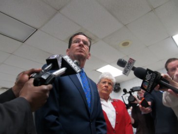 Gov. Dannel P. Malloy and Lt. Gov. Nancy Wyman talk to reporters at Cybulski.