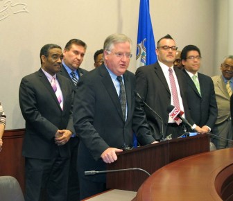 House Speaker J. Brendan Sharkey flanked by members of his task force that studied how to improve the education students who understand limited English receive.