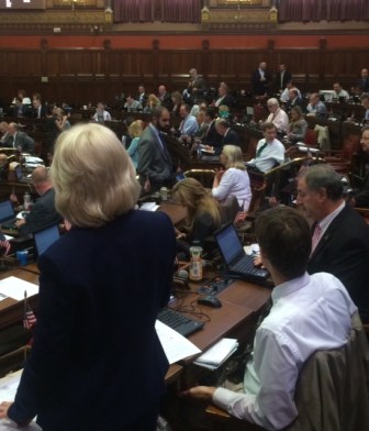 Reps. Lonnie Reed, a Democrat, and Tim Ackert, a Republican, explaining the ban on varbile electric rate contracts.