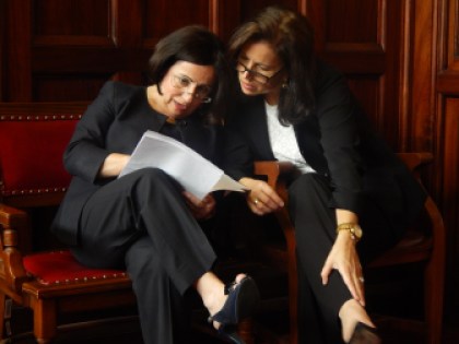 Republican Sen. Toni Boucher and Democratic Sen. Gayle Slossberg confer as Monday's special legislative session gets under way.