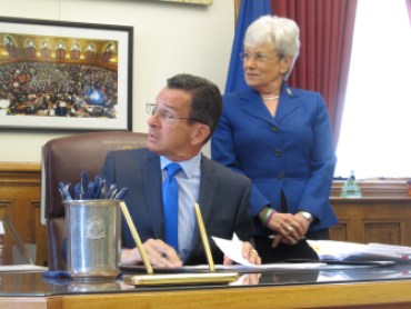 Gov. Dannel P. Malloy and Lt. Gov. Nancy Wyman at the signing of the budget bills.