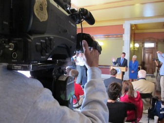 Gov. Malloy answers questions from reporters outside his Capitol office the morning after the annual legislative session ended.