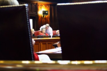 Sen. Beth Bye talks with an aide during the budget debate