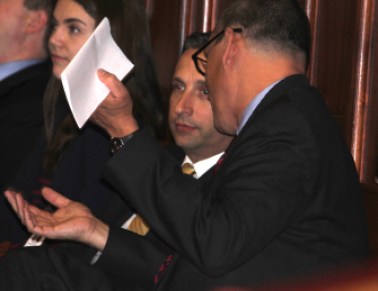 Senate Majority Leader Bob Duff, center, confers with Benjamin Barnes, the Malloy administration's budget director.