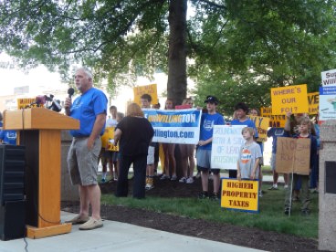 Resident Ray Crossen speaks Tuesday at a rally protesting a proposal for a state police gun range in Willington.