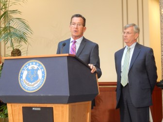 Gov. Dannel P. Malloy and Transportation Commissioner James P. Redeker answer reporters' questions after a State Bond Commission meeting Tuesday.