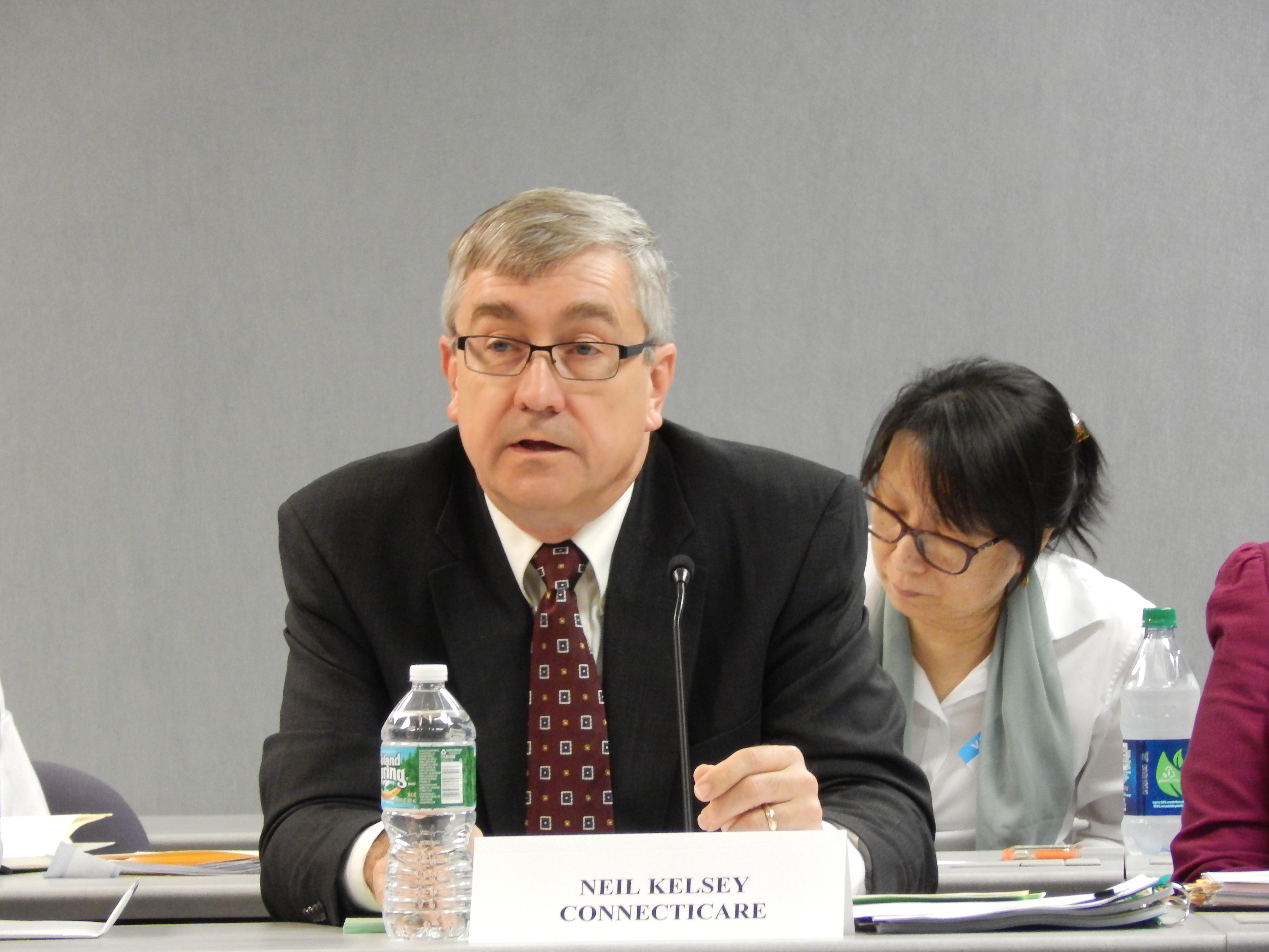 Neil Kelsey, ConnectiCare's chief actuary, testifies on the company's rate proposal at a hearing.