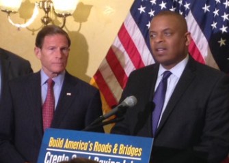 U.S. Sen. Richard Blumenthal and U.S. Secretary of Transportation Anthony Foxx, at podium.