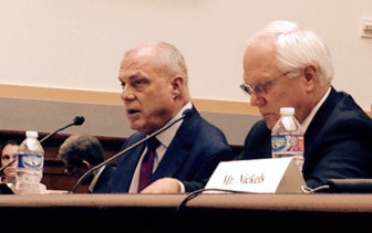 Aetna CEO Mark Bertolini, left, and Joseph Swedish, president of Anthem.