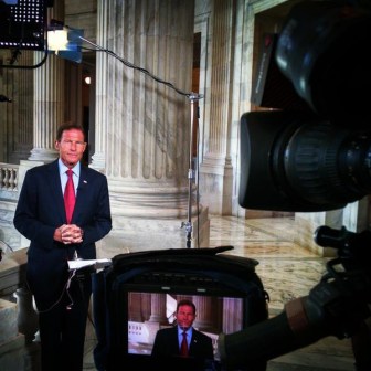 Sen. Richard Blumenthal explaining his vote on the Iran deal in front of a camera from MSNBC.