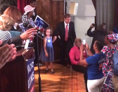 Luke Bronin and his daughter take the stage Tuesday night after winning the Democratic mayoral primary in Hartford.