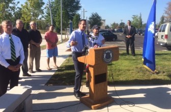 Gov. Dannel P. Malloy with John Colon, a daily commuter on CTfastrak. Commissioner James Redeker is at left.
