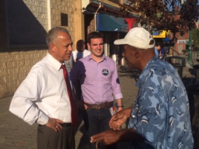 Mayor Pedro Segarra, left, and James Woulfe, a council candidate on Segarra's slate, campaigning.
