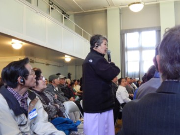 Many in the audience wore headsets to listen to the panel through an interpreter. 