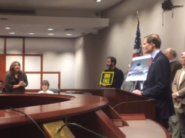 Lori Hopkins-Cavanagh, standing, addresses U.S. Sen. Richard Blumenthal about Syrian refugees at the end of his press conference Monday. Hopkins-Cavanaugh was accompanied by Wendy Hartling, seated, whose daughter was stabbed to death, allegedly by a Haitian in the country illegally.