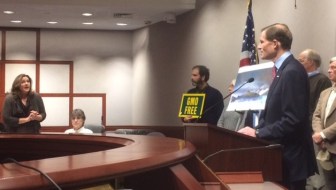 Lori Hopkins-Cavanagh, standing, addresses U.S. Sen. Richard Blumenthal about Syrian refugees at the end of his press conference Monday. Hopkins-Cavanaugh was accompanied by Wendy Hartling, seated, whose daughter was stabbed to death, allegedly by a Haitian in the country illegally.