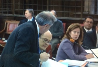 David S. Golub, left, making a point to opposing counsel, Assistant Attorney General Maura Murphy Osborne.