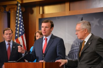 Connecticut Sens. Richard Blumenthal, left, and Chris Murphy, center, join Senate Majority Leader Harry Reid to urge tightening of the U.S. visa-waiver program.