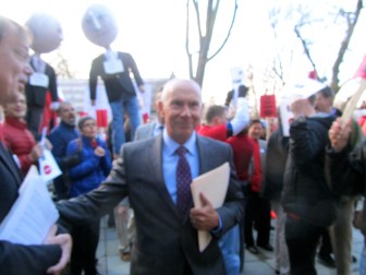 CSCU Mark Ojakian works his way through the protest