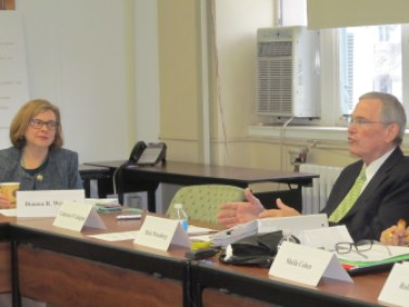 Education Commissioner Dianna Wentzell listens to teacher union leader Mark Waxenberg pitch changes to the teacher evaluation system.