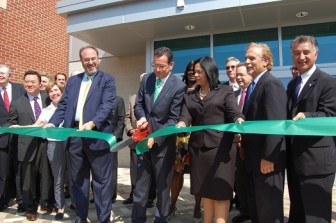 Gov. Malloy cuts the ribbon at JM Wright Technical High School, which the state spent millions to renovate.
