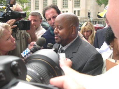 James Tillman surrounded by media after his release.