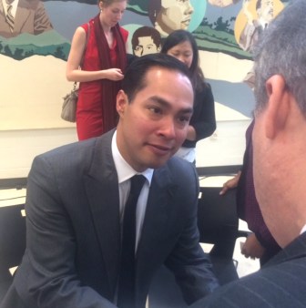 HUD Secretary Julián Castro talks to state Rep. Edwin Vargas.