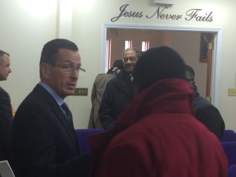 Gov. Dannel P. Malloy exits the Citadel of Love, a church where he outlined his Second Chance 2.0.