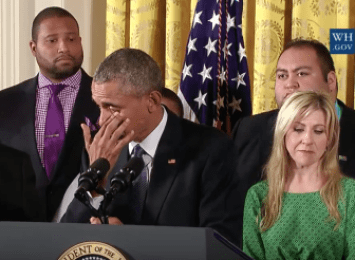 Obama wipes away tears as Jimmy Green, left, who lost his daughter Ana in the Sandy Hook shootings, looks on.