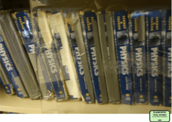 Physics text books at Windham High School held together with duct tape