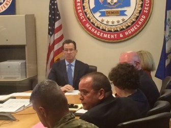 Gov. Dannel P. Malloy at a briefing on Zika. Dr. Raul Pino is second from left.