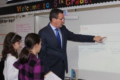 Gov. Malloy works with students on a lesson in a fifth grade class at an elementary school in Cromwell.