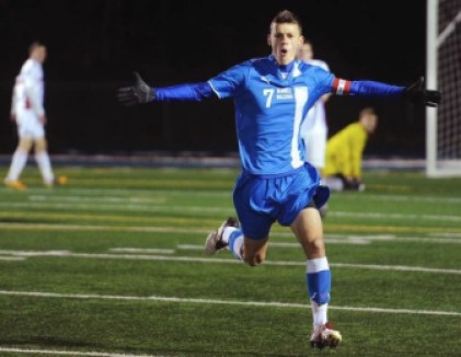 Justin Lewis celebrates on his high school soccer field in Stratford.