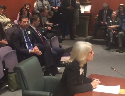 FBI director James B. Comey watches his wife, Patrice, testify in Hartford.