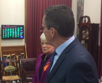 Gov. Dannel P. Malloy watches as the House vote on the deficit-mitigation bill is tallied on the screen.