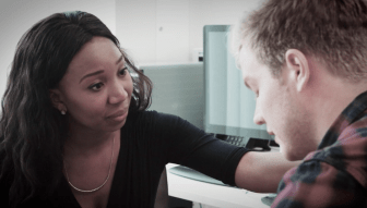 A state worker who provides mental health services is pictured in an advertisement paid for by the SEIU1199 pushing back on state employee layoffs.