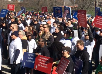 State employees rally outside the Capitol to protest threatened layoffs and requests for givebacks.