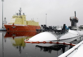 The Los Angeles-class fast attack submarine USS Alexandria (SSN 757) and the Submarine Support Vessel (SSV) Carolyn Chouest sit covered in snow on a blustery, snowy day at Naval Submarine Base New London in Groton. 