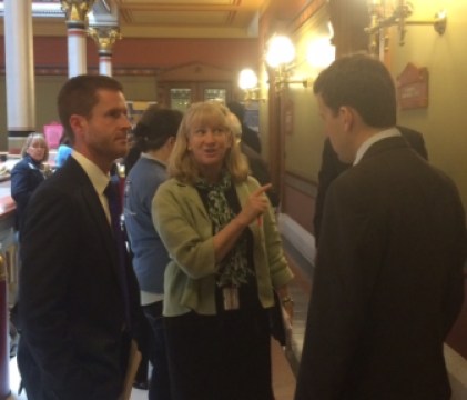 Paddi LeShane, center, lobbying Rep. Matt Lesser to vote against a nuclear-energy bill.